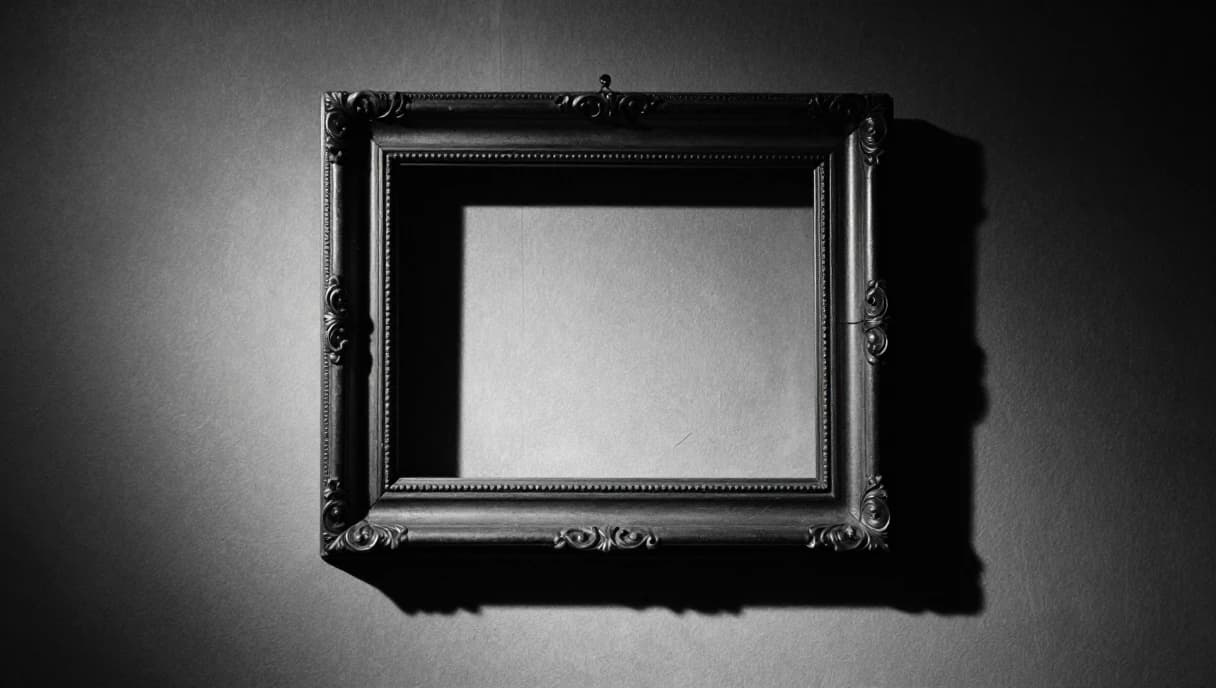 An empty picture frame on a bare wall, a black and white image about an answer given to a picture that was never looked at